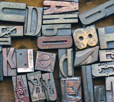 Wooden type letters jumbled as a metaphor for dyslexia